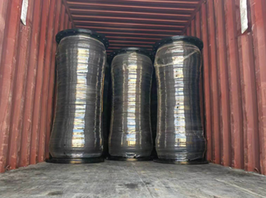 Discharge dredging hose container loading.